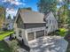 Aerial view of a modern house with a gray and white color scheme at 1312 Hunting Ridge Rd, Raleigh, NC 27615