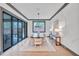 Elegant dining room with hardwood floors and sliding glass doors at 1312 Hunting Ridge Rd, Raleigh, NC 27615