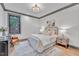 Charming bedroom with a comfortable bed and a sitting chair at 1312 Hunting Ridge Rd, Raleigh, NC 27615