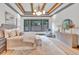 Main bedroom with a king-size bed, sitting area, and large windows at 1312 Hunting Ridge Rd, Raleigh, NC 27615