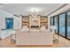 Spacious living room with built-in shelving and a fireplace at 1312 Hunting Ridge Rd, Raleigh, NC 27615