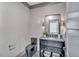 Modern powder room with dark vanity and patterned floor at 1312 Hunting Ridge Rd, Raleigh, NC 27615