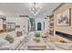 Open living space features a modern fireplace, comfortable seating, and plenty of natural light at 1312 Hunting Ridge Rd, Raleigh, NC 27615