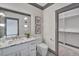 Elegant bathroom with marble vanity and walk-in closet at 1312 Hunting Ridge Rd, Raleigh, NC 27615