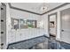 Elegant bathroom with double vanity, marble floors, and a soaking tub at 1312 Hunting Ridge Rd, Raleigh, NC 27615