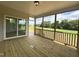Screened porch with wooden deck and access from dining room and backyard at 73 Sage Ln # 008, Four Oaks, NC 27524