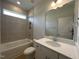 Bathroom with a tub, vanity, and modern fixtures at 73 Sage Ln # 008, Four Oaks, NC 27524