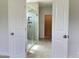 Clean bathroom with a walk-in shower, tile flooring and access to a closet at 73 Sage Ln # 008, Four Oaks, NC 27524