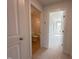 Hallway with carpet flooring, leading to bathroom and bedroom at 73 Sage Ln # 008, Four Oaks, NC 27524