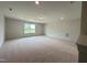 Spacious bonus room with carpet and a large window offering natural light at 73 Sage Ln # 008, Four Oaks, NC 27524