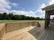 Wooden deck with railing providing backyard access and view at 73 Sage Ln # 008, Four Oaks, NC 27524
