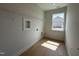 Laundry room with shelving, a window, and wood-look flooring at 73 Sage Ln # 008, Four Oaks, NC 27524