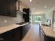 Open concept kitchen with stainless steel appliances and eat-in area at 73 Sage Ln # 008, Four Oaks, NC 27524