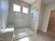 Large walk-in shower with tile surround and built-in seat at 73 Sage Ln # 008, Four Oaks, NC 27524