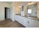 Bright bathroom with granite countertop and white cabinets at 103 Sage Ln # 009, Four Oaks, NC 27524