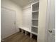 Bright entry with built-in bench, shelving, and coat hooks at 103 Sage Ln # 009, Four Oaks, NC 27524