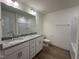 Bathroom with granite countertops, double sinks, and a bathtub at 103 Sage Ln # 009, Four Oaks, NC 27524