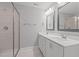 Double vanity bathroom with a large walk-in shower at 305 Sutherland Dr, Franklinton, NC 27525