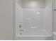Clean bathroom with a bathtub and shower at 305 Sutherland Dr, Franklinton, NC 27525