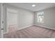 Cozy bedroom with a window overlooking the community at 305 Sutherland Dr, Franklinton, NC 27525