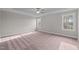 Bright bedroom with plush carpeting and ample natural light at 305 Sutherland Dr, Franklinton, NC 27525