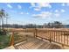Wooden deck with railing offering backyard views at 305 Sutherland Dr, Franklinton, NC 27525