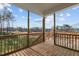 Wooden deck with railing offering backyard views at 305 Sutherland Dr, Franklinton, NC 27525