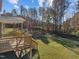 Wooden deck with railing overlooking grassy backyard at 305 Sutherland Dr, Franklinton, NC 27525