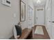 Bright foyer with a bench, wood floors, and French doors at 305 Sutherland Dr, Franklinton, NC 27525
