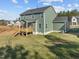 Two-story house with deck and stairs, surrounded by a grassy yard at 305 Sutherland Dr, Franklinton, NC 27525