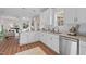 Open concept kitchen with white cabinets, granite counters, and island at 305 Sutherland Dr, Franklinton, NC 27525