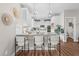 Modern kitchen with white cabinets, granite countertops and breakfast bar at 305 Sutherland Dr, Franklinton, NC 27525