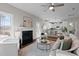 Open concept kitchen with island and breakfast bar, flows into living area at 305 Sutherland Dr, Franklinton, NC 27525