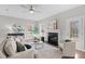 Spacious living room features a fireplace, large windows, and comfortable seating at 305 Sutherland Dr, Franklinton, NC 27525