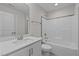 Clean bathroom with white vanity, tub, and shower combination at 345 Sutherland Dr, Franklinton, NC 27525