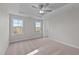 Bright bedroom featuring carpet, ceiling fan, and access to a closet at 345 Sutherland Dr, Franklinton, NC 27525