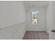 Well-lit closet with wire shelving and a window offering natural light at 345 Sutherland Dr, Franklinton, NC 27525