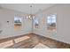 Sunlit dining area with hardwood floors and large windows at 345 Sutherland Dr, Franklinton, NC 27525