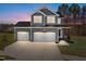 Two-story home with gray siding, white trim, and a two-car garage at 345 Sutherland Dr, Franklinton, NC 27525