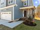 Front entrance with brick steps and a covered porch at 345 Sutherland Dr, Franklinton, NC 27525
