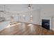 Spacious living room with hardwood floors, fireplace and access to deck at 345 Sutherland Dr, Franklinton, NC 27525