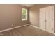 Spacious bedroom with neutral walls, plush carpet and double door closet at 809 E Edgerton St, Dunn, NC 28334