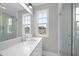Elegant bathroom with quartz countertop and glass shower at 2635 Marchmont St, Raleigh, NC 27608
