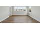 Light and airy bedroom with hardwood floors and large windows at 2635 Marchmont St, Raleigh, NC 27608