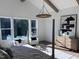 Relaxing main bedroom with a king-size bed, large windows, and high ceilings at 43 Laurel Knoll Dr, Pittsboro, NC 27312