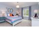 Bright bedroom with a comfy bed and stylish decor at 6829 Sleeping Meadow Ln, Holly Springs, NC 27540