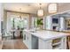 Bright kitchen with a large island, breakfast nook, and stainless steel appliances at 6829 Sleeping Meadow Ln, Holly Springs, NC 27540