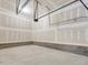Unfinished two-car garage with overhead storage at 17 Shelby Meadow Ln, Angier, NC 27501