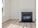 Modern gas fireplace with a dark surround and white mantel at 17 Shelby Meadow Ln, Angier, NC 27501