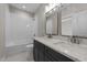 Bathroom features a double vanity, white subway tile, and a soaking tub at 125 Cotton Fields Ln # 26, Fuquay Varina, NC 27526